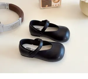 Top view of black matte PU leather Mary Jane shoes for girls with velcro strap and white insole