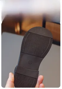 Detailed view of non-slip rubber sole with horizontal grip texture for girls' shoes