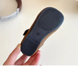Detail view of anti-slip rubber sole with size 23 engraving on children leather shoes