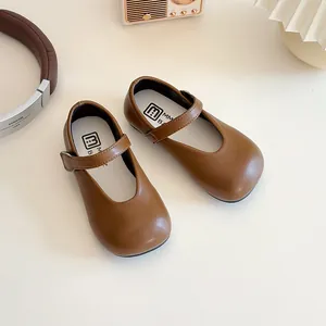 Retro brown Mary Jane shoes for girls with velcro straps and round toe design