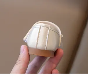 Detail of reinforced heel stitching and durable anti-slip rubber sole on girls' flats