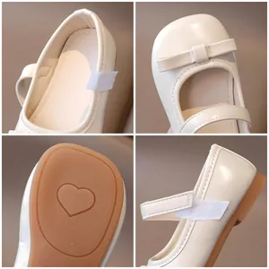 Girl's cream Mary Jane shoes with bow detail and heart pattern anti-slip sole