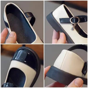Classic black and white Mary Jane shoes for girls featuring a cute cat pendant and gold ring