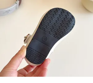 Detail of baby shoe rubber sole with non-slip wavy pattern and size 18 marking