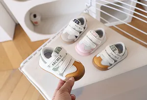 Detail view of breathable mesh toddler sneakers with dual hook-and-loop straps