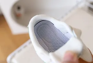 Close-up of soft padded heel and breathable mesh lining of the infant walking shoes