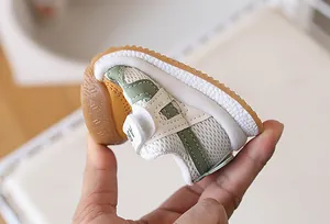 Macro shot of ultra-flexible rubber sole on breathable mesh baby walking shoes