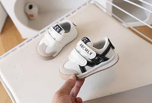 Detail of toddler mesh sneakers showing breathable fabric and dual velcro closure