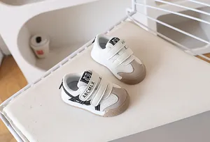 Detail of toddler sneakers featuring breathable mesh fabric and dual hook-and-loop straps