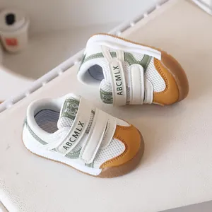 Breathable mesh baby sneakers with green trim and non-slip rubber sole for toddlers
