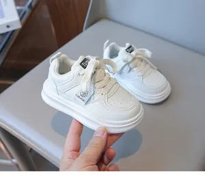 Close-up of white children's sneaker featuring CLDB SPORT label and thick sole texture