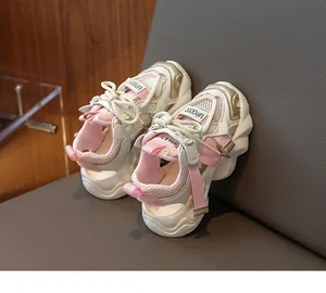 Close-up of pink breathable mesh fabric and hollow design on children's summer sandals