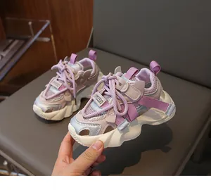 Macro detail of breathable mesh fabric and purple velcro strap on kids' sports sandals