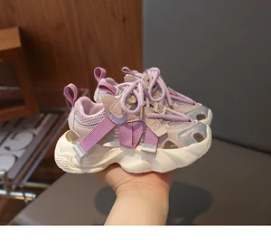 Detail of pink and purple children's mesh sports sandals with velcro strap and chunky sole