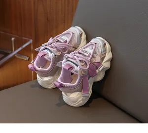 Detail of purple breathable mesh upper and thick white rubber sole on kids sandals