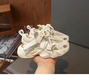 Detailed macro view of the thick EVA wave sole and breathable mesh on children's sandals