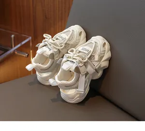 Detail of breathable cream mesh and thick chunky sole on girls' sport sandals