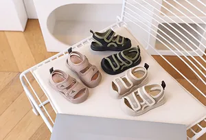 Detailed view of breathable toddler sandals with protective closed toes and velcro straps