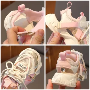 Pink and white breathable mesh kids' sports sandals with velcro straps for summer wear