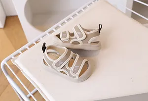 Detail of closed-toe toddler sandals with dual velcro straps and mesh upper for breathability
