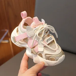 Pink and white breathable kids sports sandals with mesh cutouts and velcro straps
