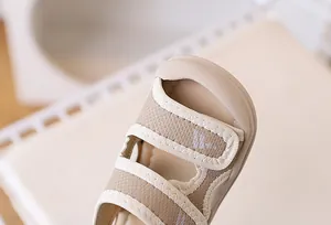 Detail of baby beach sandals featuring protective toe cap and breathable mesh material