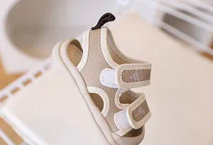 Detail of toddler mesh beach sandals featuring double hook-and-loop straps and a thick sole