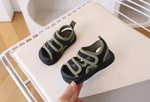 Detail view of toddler beach sandals with secure double hook and loop straps and toe protection