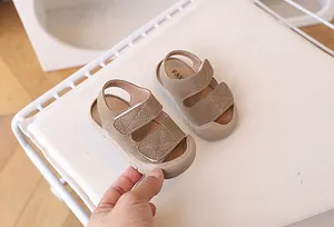 Close-up of khaki toddler sandals with double hook-and-loop straps and anti-collision toe