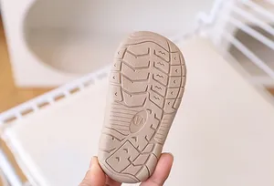 Close-up of flexible non-slip rubber sole with size 17 engraving for baby sandals