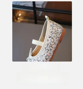 Detail view of silver sequin ballet flats for girls with elastic strap and rubber sole