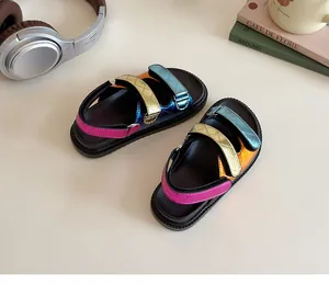 Detail view of metallic colorful kids sandals with quilted straps and velcro closure