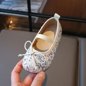Sparkly silver sequin Mary Jane flats for girls with bow detail and elastic strap