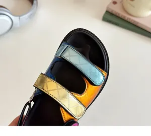 Detail of colorful metallic leather straps and thick non-slip rubber sole for kids sandals