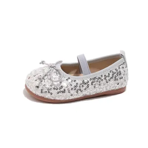 Silver sequins Mary Jane flats for kids with bow detail and elastic strap on white base