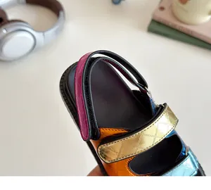 Close-up of colorful quilted metallic straps on fashionable kids sandals with soft thick soles