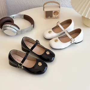 Scarpe Mary Jane da bambina in nero e bianco con fibbie a fiore dorato per primavera