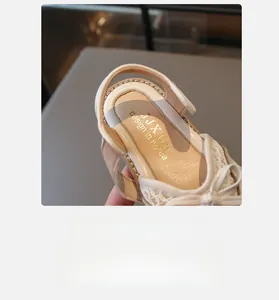 Detail shot of girls' sandals featuring soft lace bows and cushioned inner soles