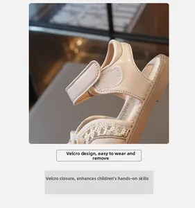 Close-up of beige children's sandals featuring a practical velcro strap for easy wear