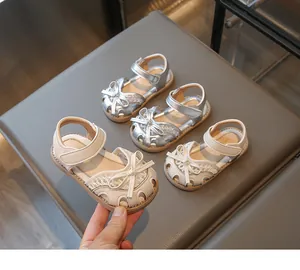 Close-up of girl's princess sandals featuring lace texture and bowknot detail