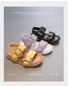 Three pairs of open-toe children's sandals in yellow, purple, and black with double straps