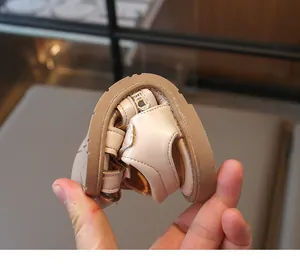 Flexible soft leather sole showing high elasticity of kids bow princess sandals