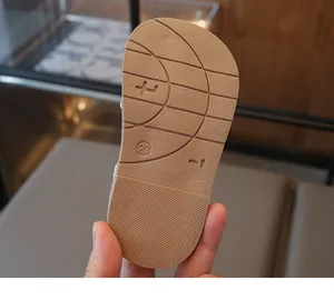 Close-up of flexible non-slip rubber sole with size 23 on girls' summer sandals