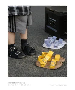 Detail of children's non-slip sandals in black blue and yellow with double buckles