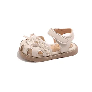 Girl's beige princess sandals with closed toe bow design and lace mesh details