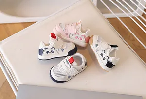 Flat lay of toddler mesh sneakers in pink and blue featuring cute panda patterns