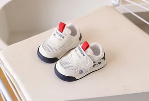 Detailed view of baby mesh sneakers with panda motif and velcro closure for walking