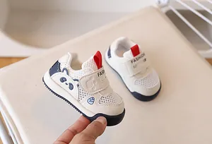 Detail of breathable mesh toddler sneaker with panda motif and velcro strap closure