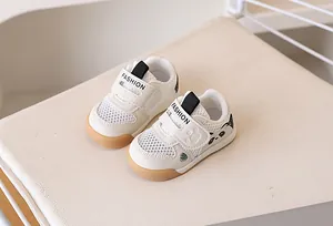 Detailed view of breathable mesh toddler shoes with panda motif and velcro closure