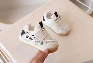 Close-up of baby sport sandals with breathable mesh and cute panda design on white background